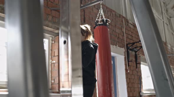 Female Boxer Warming Up Before Training