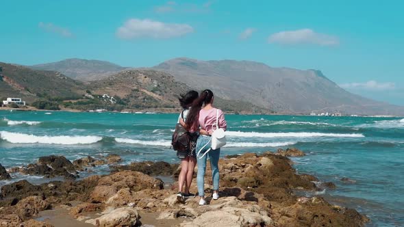 Two Young Girls Enjoying Nature at the Seaside