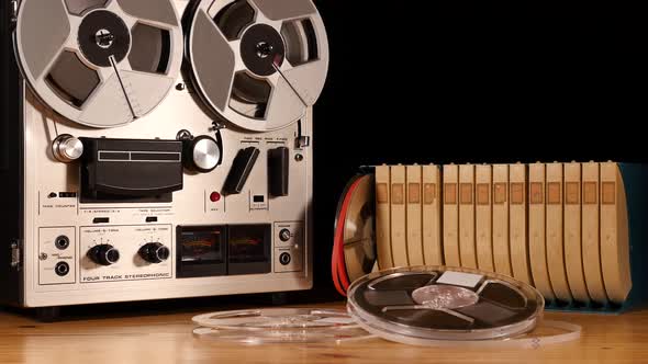 Taperecorder playing music isolated on black background and space for copy