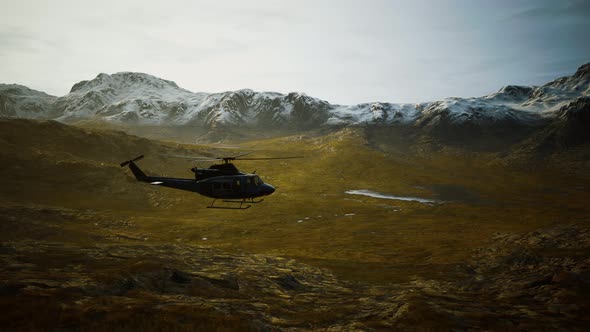 Slow Motion Vietnam War Era Helicopter in Mountains alt