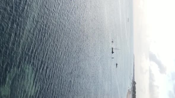 Vertical Video of the Ocean Near the Coast of Zanzibar Tanzania Aerial View