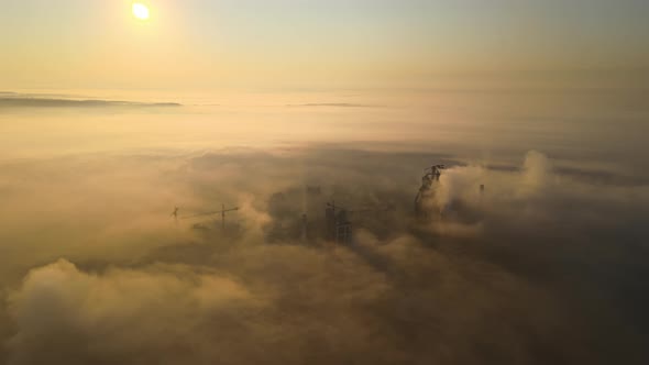 Aerial View of Cement Factory with High Concrete Plant Structure and Tower Crane at Industrial