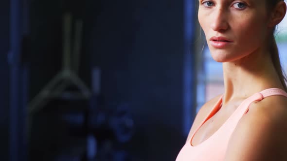 Portrait of woman in sportswear standing in gym