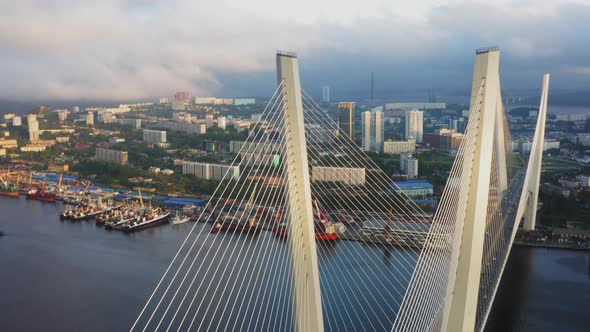 View From a Drone Vertically Down to the Golden Bridge and the City at Sunset