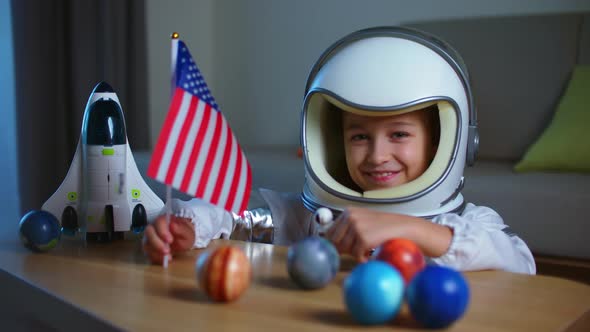 Child Playing at Home in an Astronaut Portrait of a Little Girl 8 Years Old in an Astronaut Costume