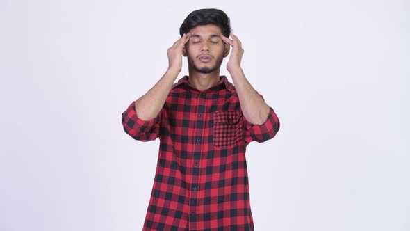 Young Stressed Bearded Indian Hipster Man Having Headache