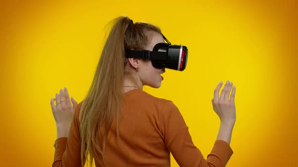 Girl Using Virtual Reality Futuristic Technology VR Headset Helmet to Play Simulation 3D Video Game