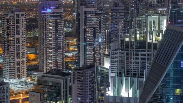 Dubai Marina Skyscrapers and Jumeirah Lake Towers View From the Top Aerial Night Timelapse in the