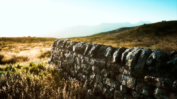 Scottish Land Border Stone Wall at Sunset