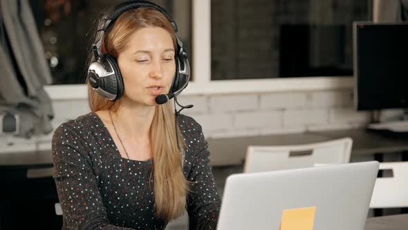 Friendly Pleasant Telemarketing Operator Consulting Customer About Online Shop.