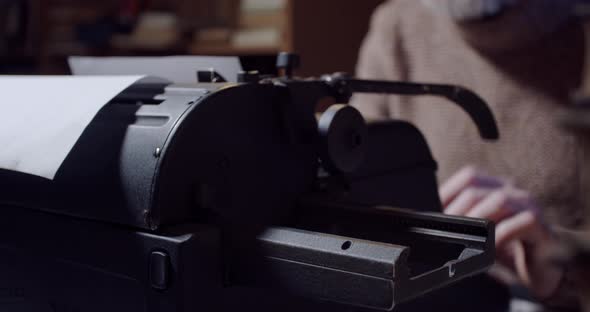 Typewriter in use, a man is writing a novel, close up in 4k