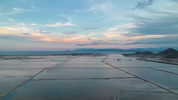 Day to night timelapse of glossy wide salt farms, Ninh Thuan, Vietnam