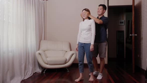 Asian young man surprise girlfriend after renovating a living room for her gift.