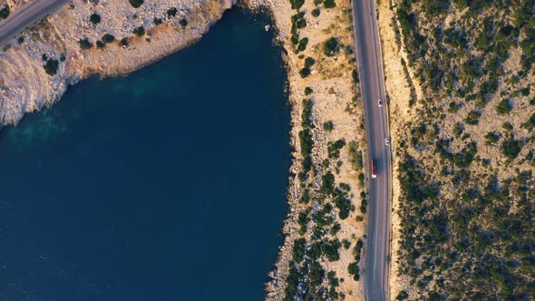 Aerial Drone View of Cars Driving on the Road Near the Sea