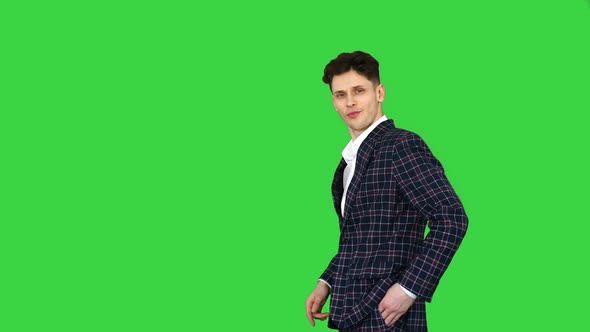 Man in Formal Business Suit Walks in and Dances Several Hip Hop Moves To Camera on a Green Screen