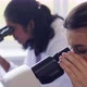 Scientists with Microscopes Working in Laboratory - VideoHive Item for Sale