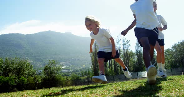 Children running in park during race