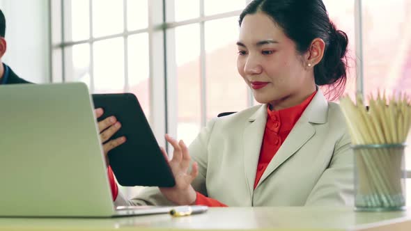 Business People Working at Table in Modern Office