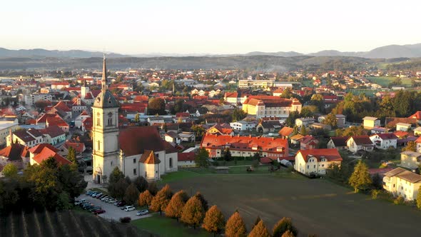 Aerial Panorama view of small medieval european town Slovenska Bistrica, Slovenia with church and ca