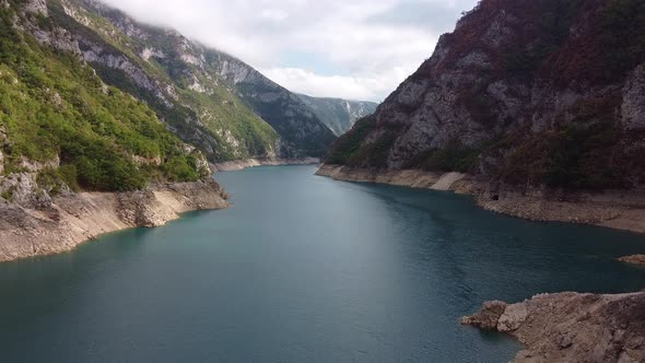 Wide Azure River Flowing Through a Mountain Valley