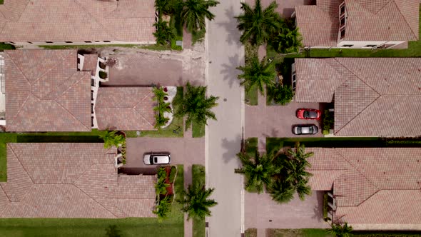 Aerial Overhead Shot Rising Above Homes In Neighborhood