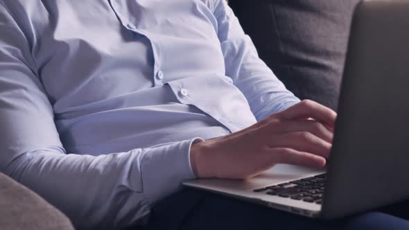 Man Surfing Internet on PC in Flat