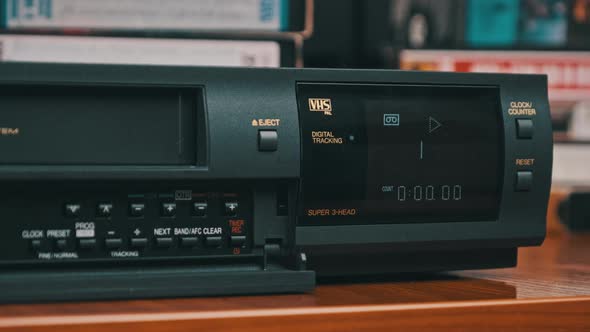 Insert VHS Cassette Into VCR and Push Play Button