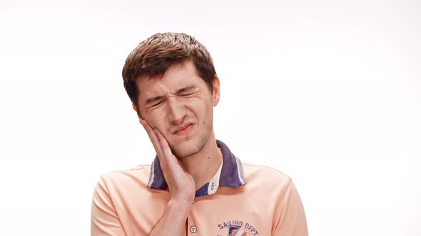 Young Handsome Man Have Toothache Over White Background