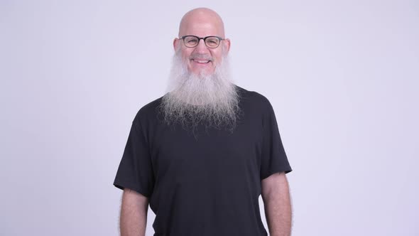 Happy Mature Bald Bearded Man with Eyeglasses Smiling