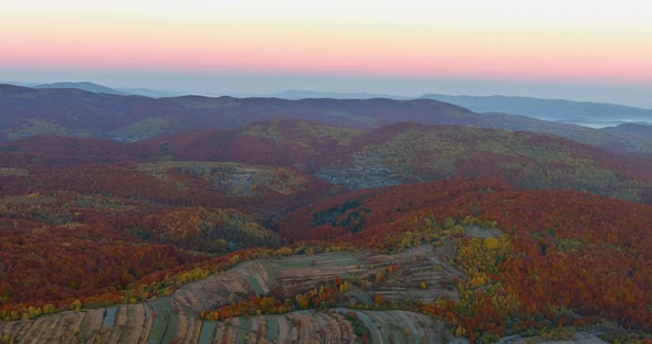 Beautiful Sunrise Over the Mountain Range at the Autumn Forest Landscape