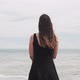 Girl In Black Dress Lookig At The Sea - VideoHive Item for Sale