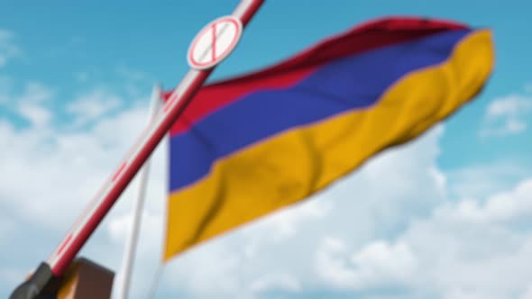 Barrier with STOP CORONAVIRUS Sign Closed at Flag of Armenia