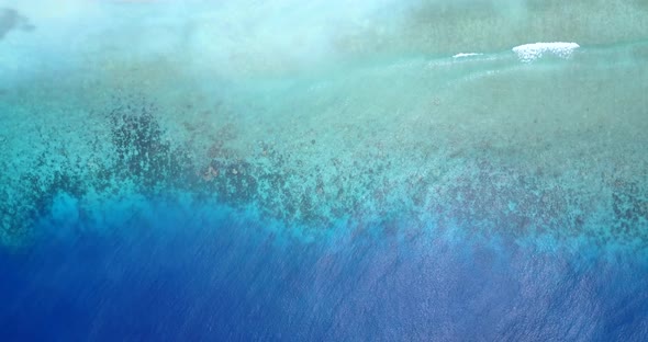 The Overhead Scenery Of The Coral Reef In The Bahamas On A Bright Sunny Day - Aerial Shot