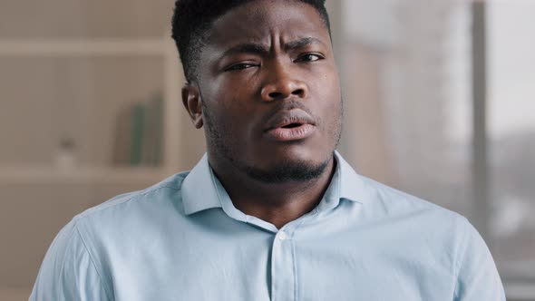 Close Up Male Portrait of Confused Shocked African American Millennial 30s Man Young Adult Guy