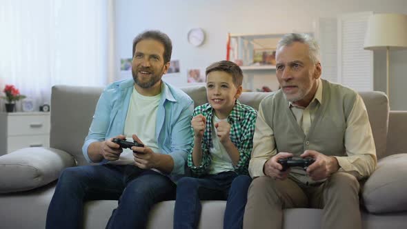 Preteen Boy Cheering for Dad and Granddad Playing Video Game, Pappy Time, Hobby