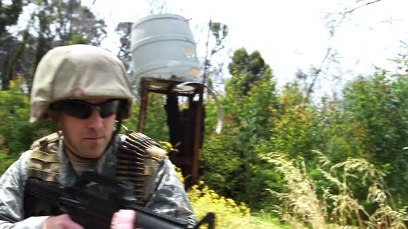 Military soldier guarding with a rifle