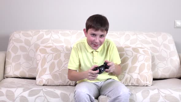 Little Boy Playing Video Games at Home, Slowmotion