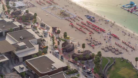 Waterfront Overview Jumeirah Beach Residence JBR Skyline Aerial Timelapse with Yacht and Boats