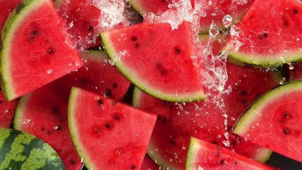 Super Slow Motion Shot of Splashing Water on Fresh Watermelon Slices