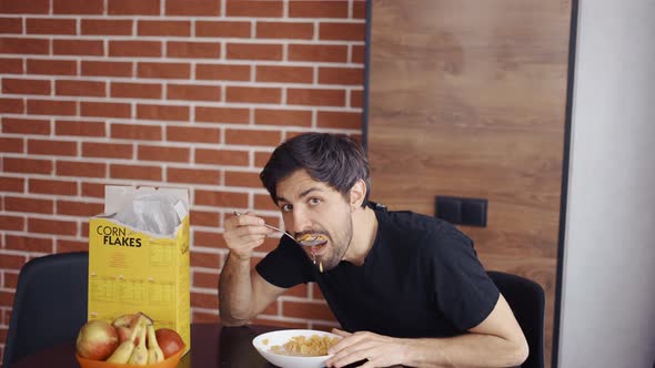 Guy Eating Cornflakes Funny Posing for Camera