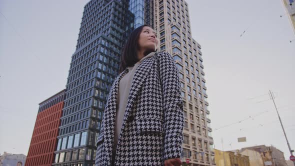 Lowangle Portrait of a Young Adult Asian Woman in Downtown District