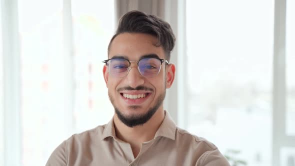 Portrait of Smart Indian Business Man Looking at Camera at Home Office