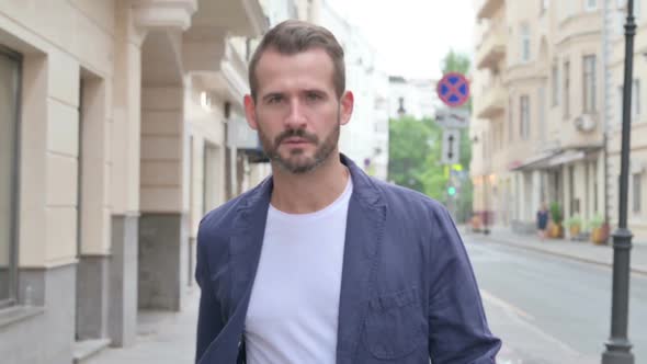 Close Up of Mature Adult Man Walking in a Street Slow Motion