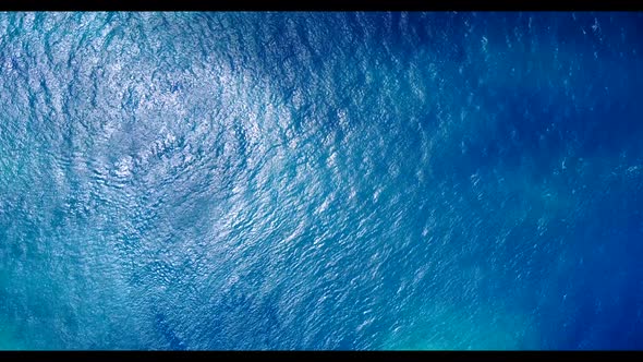 Aerial drone view seascape of perfect coast beach break by blue ocean with white sandy background of
