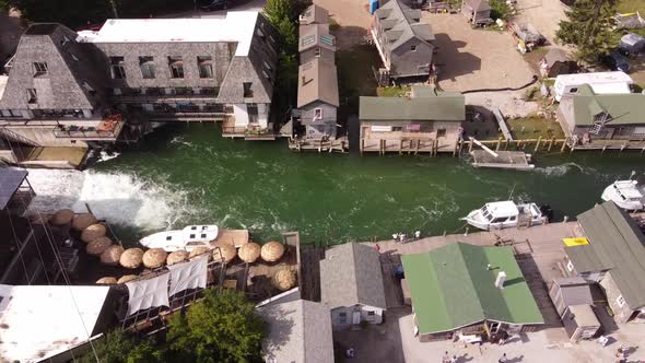 Aerial View Of Small Fishing Town In Michigan - Fish Town, Leland Michigan - drone shot