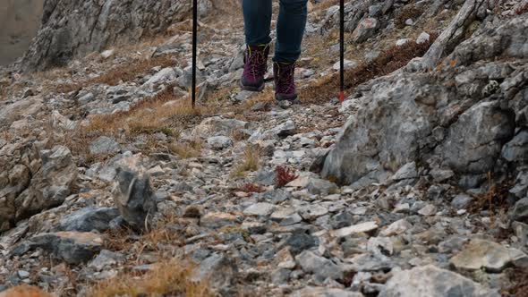 Closeup of Woman Traveler Crossing Rocky Terrain