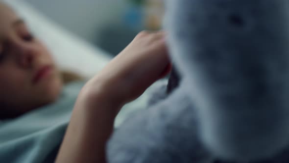 Portrait Upset Kid Hospital Ward Playing with Plush Toy