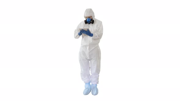 Male Doctor in Protective Suit Using Digital Tablet on White Background