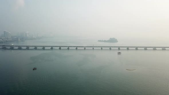 Car, boat near Penang Bridge.