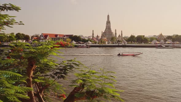 Thailand Bangkok Sunset River City Scene, Tourist Boat Trip Water Taxi and Buddhist Temple of Wat Ar